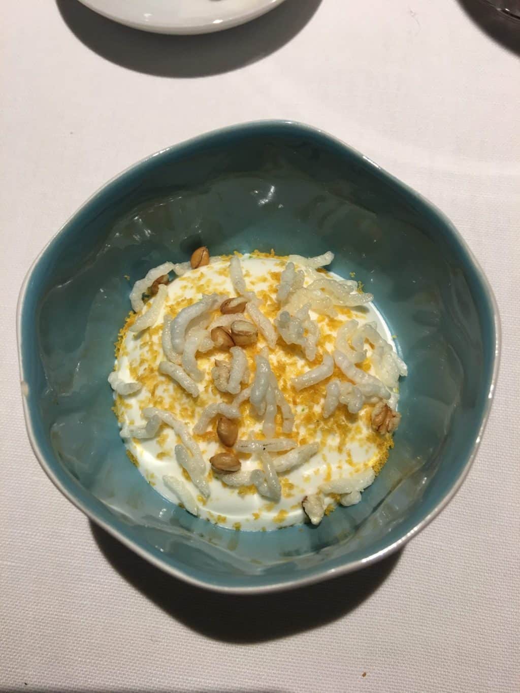 Bowl of Tartar of Mullet from the open sea with a rice emulsion and white sesame seeds
