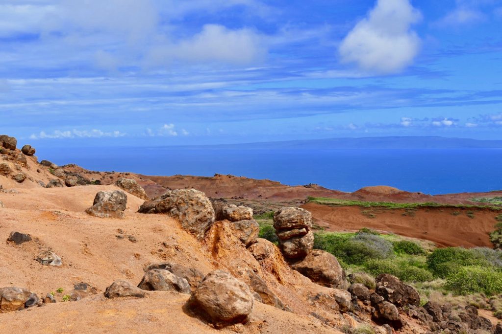 Garden of the Gods with red rocks and blue ocean in background- Lanai Hawaii