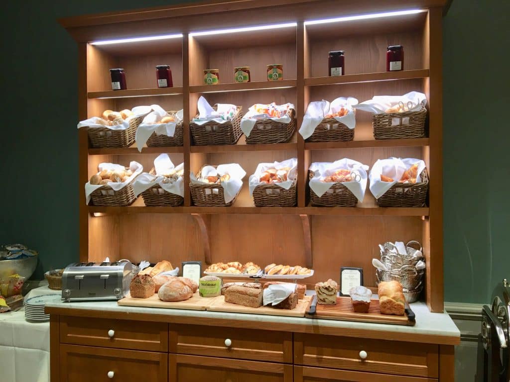 Bread and roll cupboard at breakfast buffet Brenners Park-Hotel & Spa