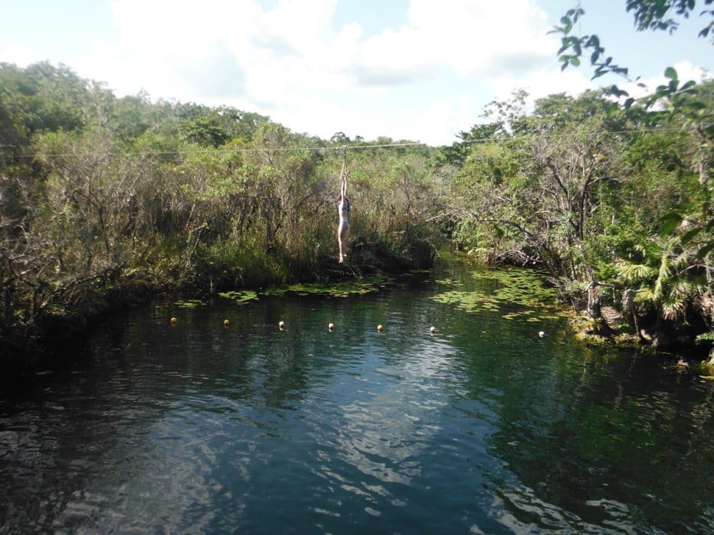 Adventure Travel: Adventure Seekers Zip lining into the Cenotes