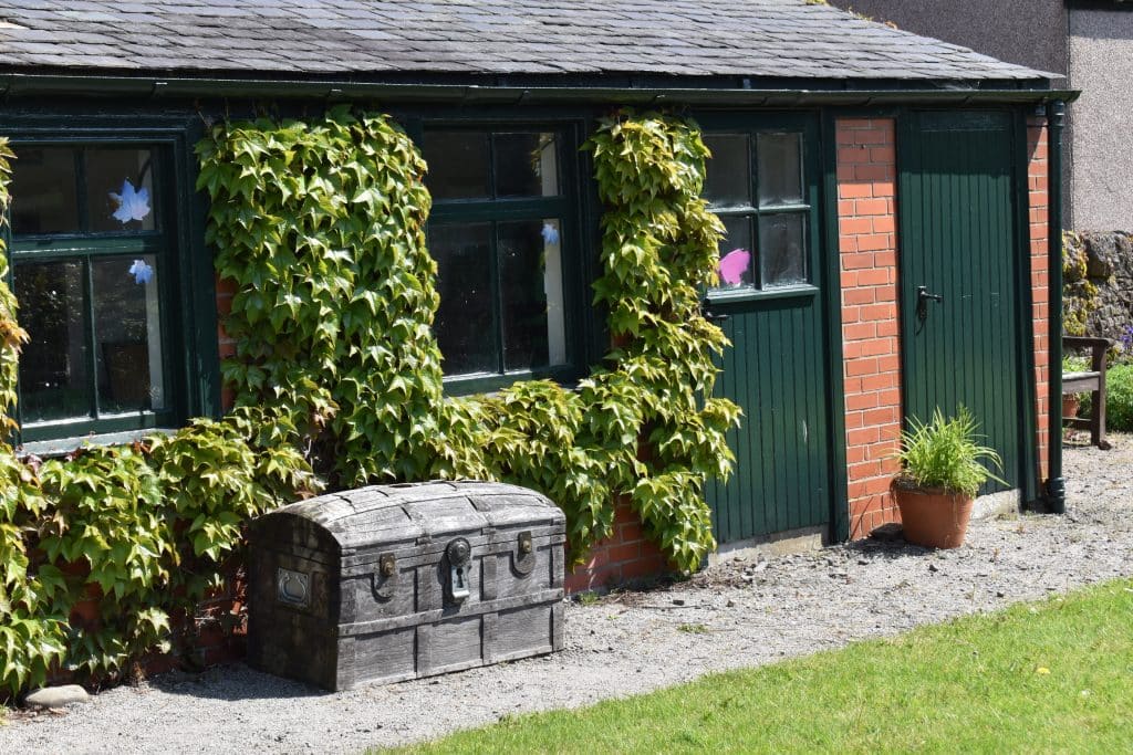 Storage house with chest at Peter Pan Novelist, J.M. Barrie: Childhood home, Kirriemuir Scotland. Garden area