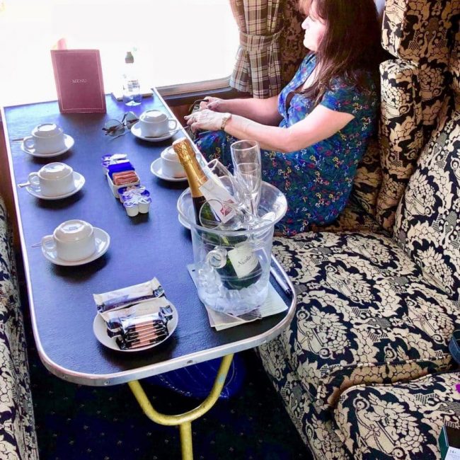sitting on Jacobite steam train